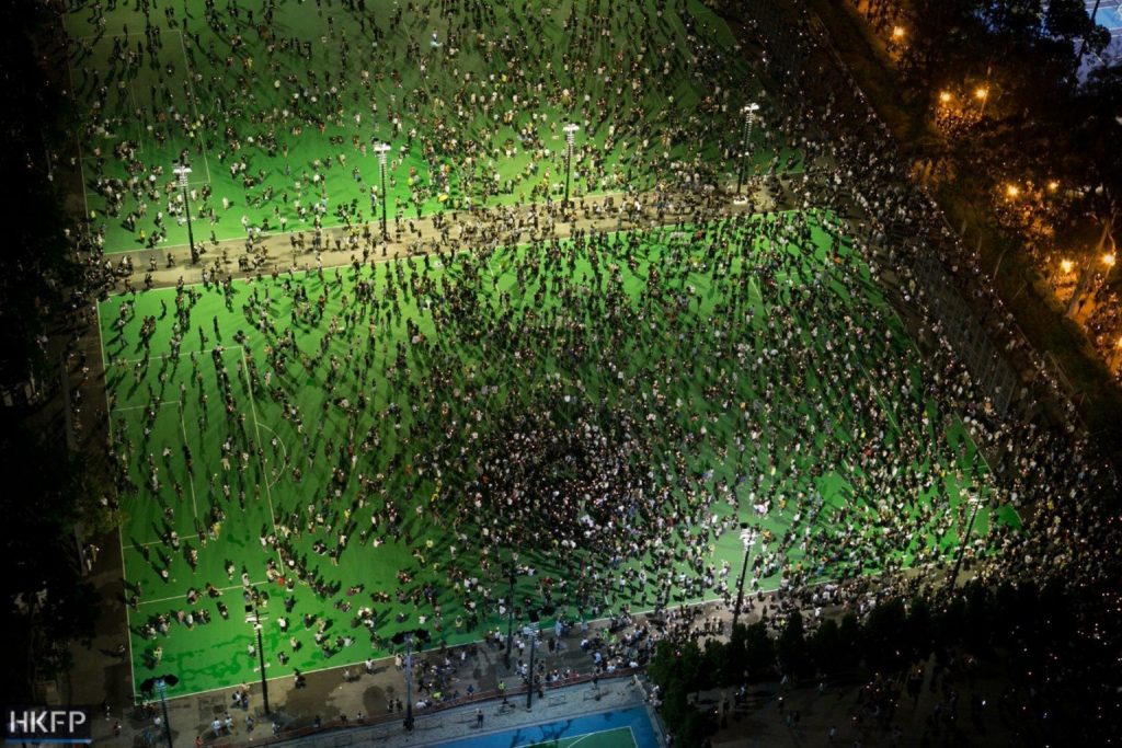 crowds on a green football pitch